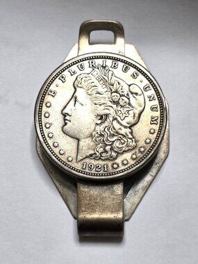1921    Silver Dollar in a money clip Coin is in excellent condition rated EF43